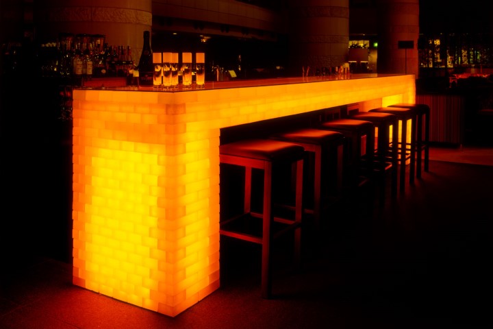 photo of GlassOre used for the bar counter and piano stage. The light through the glass has a unique presence and makes the place memorable.